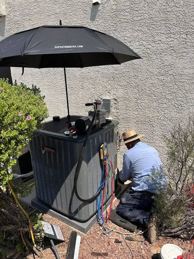 HVAC technician performing outdoor AC maintenance in Suisun City