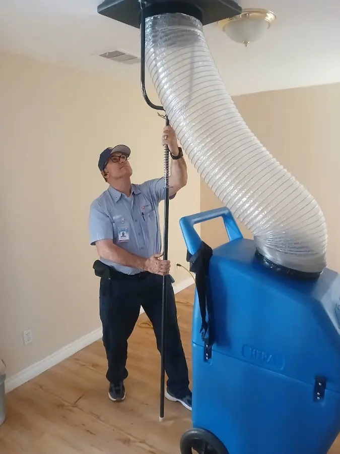 Furnace Tune-Up technician using HEPA equipment in Suisun City